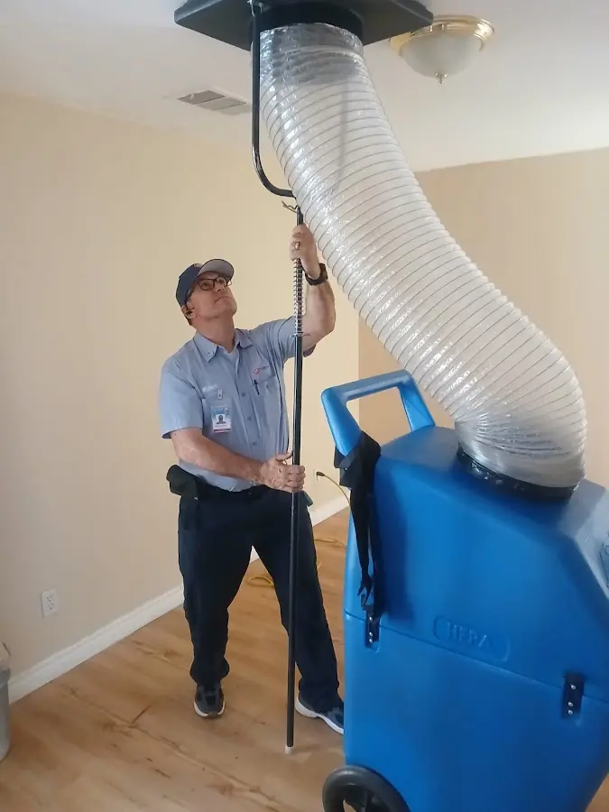 Furnace Tune-Up technician using HEPA equipment in South San Jose Hills
